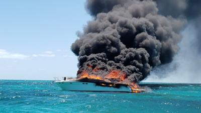 What should you do if the motor on your boat catches fire